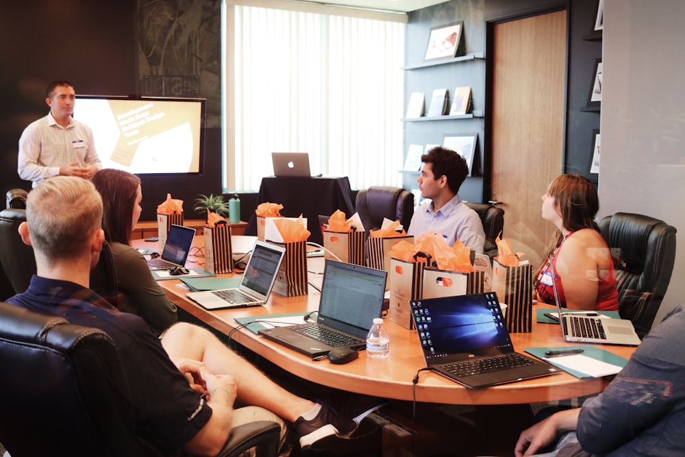 Team meeting discussing remote hiring framework and options